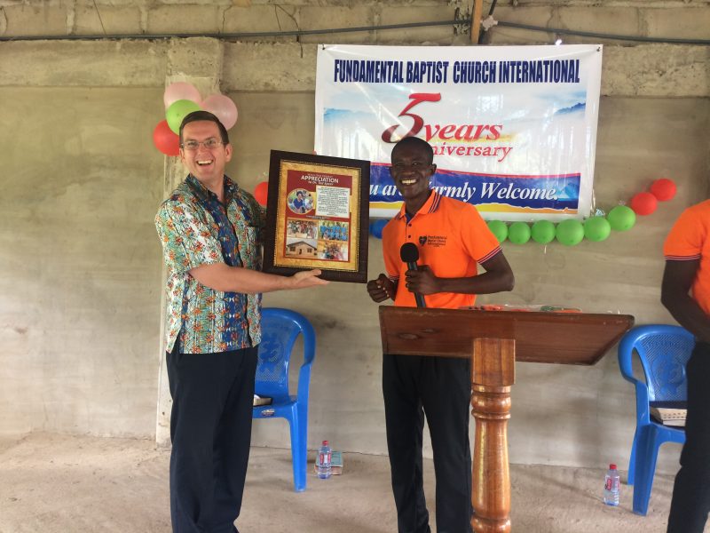 Pastor Rexford presents Pastor Speer with a plaque of appreciation