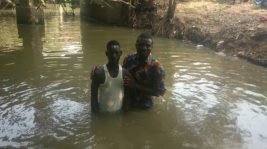 Pastor Isaac baptizing a convert