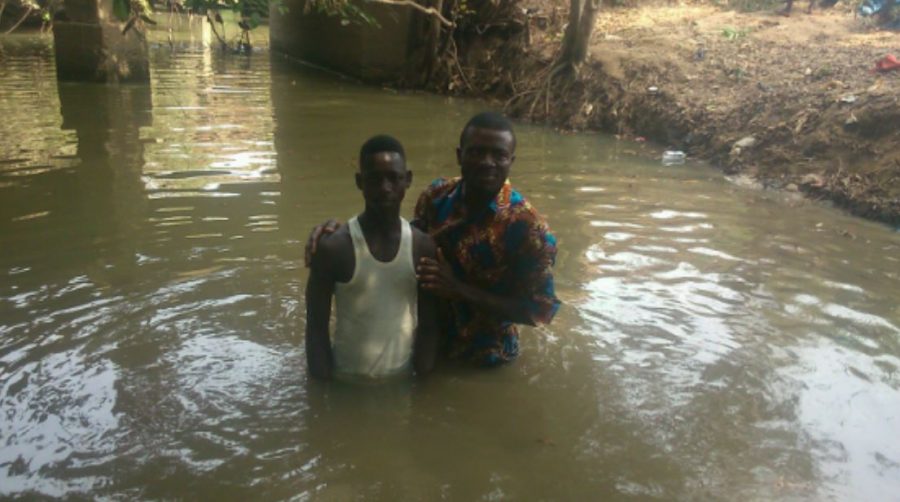 Pastor Isaac baptizing a convert